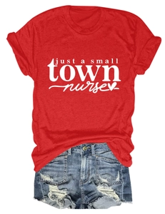 Flat lay of red Just a Small Town Nurse tee paired with distressed denim shorts