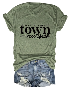 Grass green cotton t-shirt with Just a Small Town Nurse print and frayed denim shorts