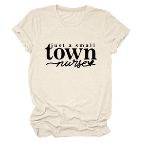 Detail of just a small town nurse text and heart print on cream cotton t-shirt