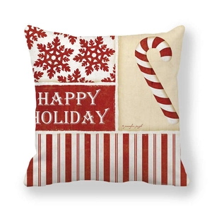 Close-up of Christmas peach skin pillowcase featuring Happy Holiday text and candy cane patterns