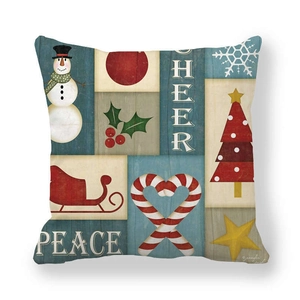 Detail of Christmas peach skin pillow cover with vintage snowman and festive motifs