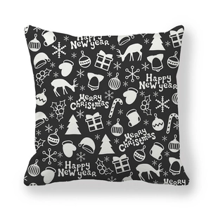 Detail of black Christmas pillowcase with white reindeer and snowflake motifs