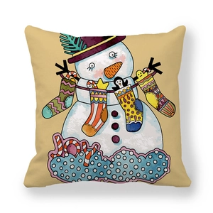 Detailed close-up of a festive snowman pillowcase with JOY text and Christmas graphics