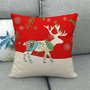 Detailed view of Nordic linen Christmas deer pillowcase on a grey sofa background