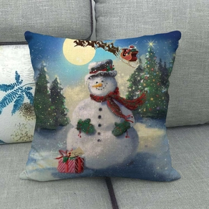 Detailed texture of linen Christmas pillowcase with snowman and sleigh print on sofa