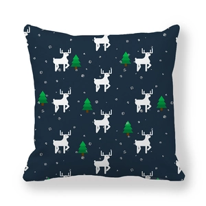 Detail of Christmas reindeer and pine tree pattern on navy peach skin pillowcase