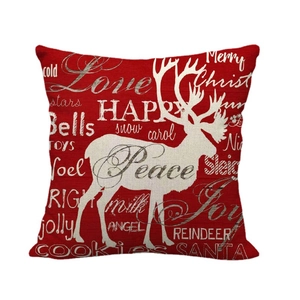 Nordic red linen Christmas pillow case with white reindeer silhouette and holiday greetings