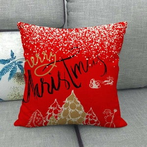 Detailed texture of red linen Christmas pillowcase with Merry Christmas text on a sofa