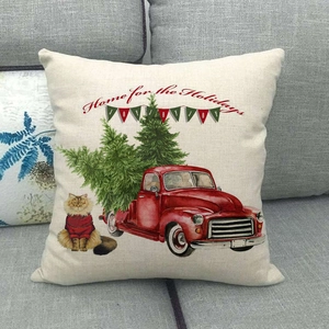 Christmas truck and cat linen pillowcase with Home for the Holidays print on sofa