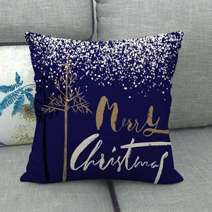 Navy linen Christmas cushion cover with golden tree and Merry Christmas text on sofa