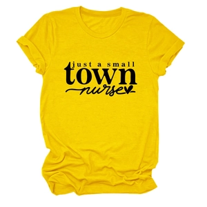 Detail of a bright yellow cotton T-shirt featuring a black 'just a small town nurse' graphic