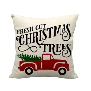 Christmas linen pillowcase featuring a red truck with fresh cut trees on white background