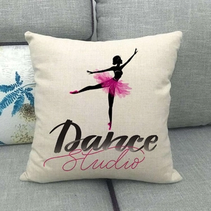 Linen pillow cover featuring a ballet dancer silhouette and Dance Studio print on a sofa