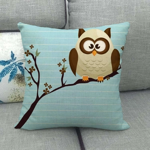 Close-up of linen pillowcase with cute owl print on a textured light blue fabric
