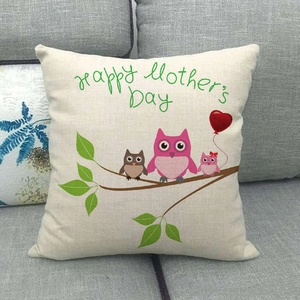 Linen Mother's Day pillow cover with cartoon owls on a gray sofa backdrop