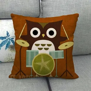 Detailed texture of orange linen pillow cover featuring a cartoon owl playing drums