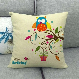 Cartoon owl linen cushion cover with Happy Birthday tree print on grey sofa