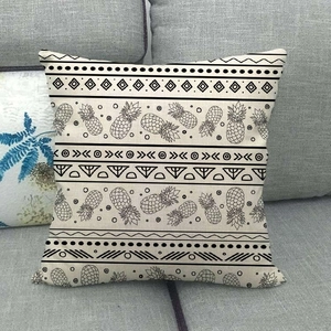 Detailed view of square linen pillowcase featuring black pineapple and geometric patterns