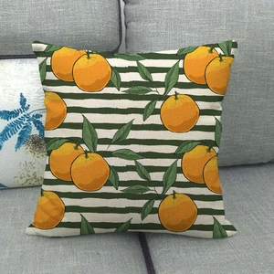Detailed texture of pineapple pattern linen pillowcase on a grey fabric sofa