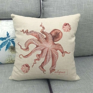 Detailed macro of the durable linen fabric and red vintage octopus print on the cushion cover