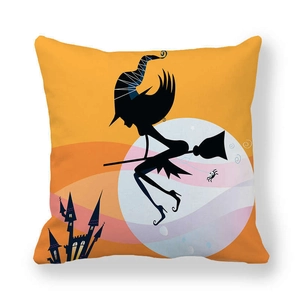 Detail of Halloween pillowcase with orange base and black witch silhouette flying in the moonlight