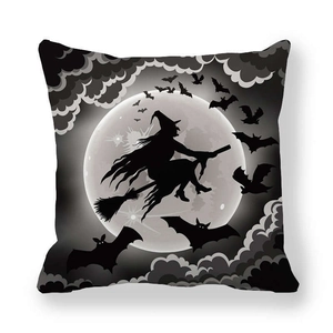Detail of Halloween pillowcase featuring a witch silhouette riding a broom against the moon