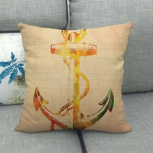 Close-up of anchor printed linen pillow cover on a grey sofa for coastal home decor