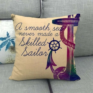 Linen anchor and helm square pillow cover on grey sofa featuring nautical quotes