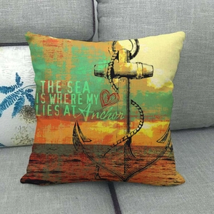 Vintage nautical anchor cushion cover with linen texture on a gray sofa for home decor
