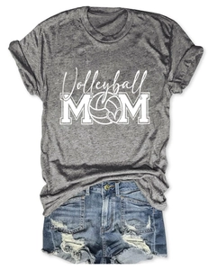 Flat lay of a grey Volleyball Mom T-shirt paired with distressed denim shorts