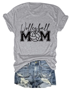 Flat lay of gray Volleyball MOM t-shirt paired with distressed blue denim shorts