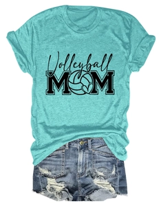 Flat lay of a teal volleyball mom t-shirt and distressed denim shorts on white background