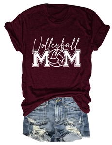 Close-up of Volleyball MOM graphic print on a soft burgundy cotton t-shirt fabric
