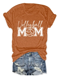 Detail of Volleyball Mom print on terracotta cotton t-shirt with denim shorts