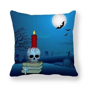 Detailed view of Halloween pillow cover featuring a skull, red candle, and moonlit cemetery