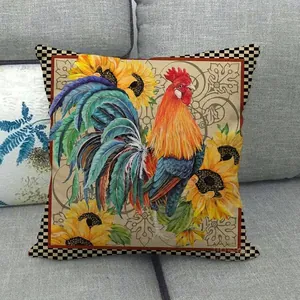 Détail d'une housse de coussin à motif coq et tournesol avec bordure en damier