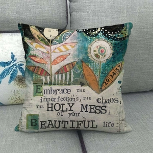 Detail of artistic linen pillowcase featuring vintage collage patterns and inspiring quotes