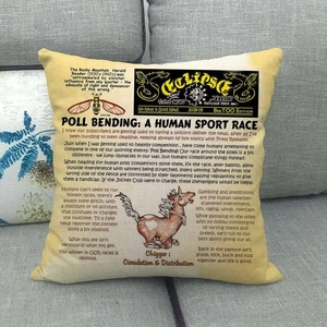 Detailed view of yellow linen pillowcase with vintage newspaper print on a grey sofa