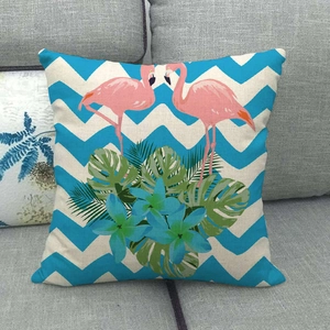 Close-up of tropical flamingo linen pillowcase with blue chevron and monstera pattern