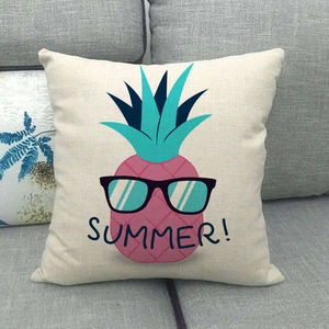 Detail of linen pillowcase featuring a pink pineapple with sunglasses and Summer text