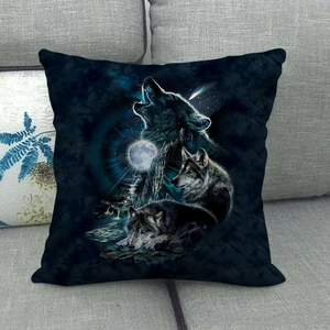 Detail of square pillowcase with wolf moon and shooting star print on a grey sofa