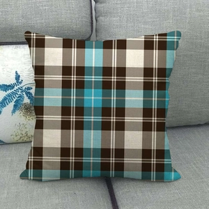 Close-up of linen-style square pillowcase with classic blue and brown tartan plaid pattern