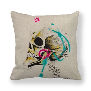 Detail of linen pillowcase featuring a graffiti skull print with pink crown art