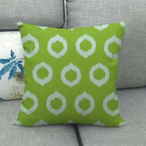 Linen geometric pattern cushion cover in bright green and white ethnic circles