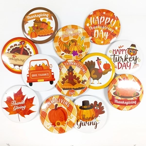 12-piece Thanksgiving tinplate badge set with turkey, pumpkin, and autumn leaf designs