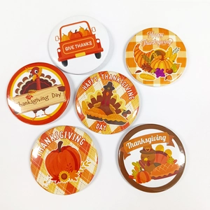 Detailed view of six tinplate Thanksgiving badges with pumpkins and turkeys motifs