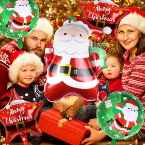 Close-up of Christmas foil balloons featuring Santa Claus and Merry Christmas stars