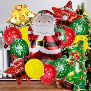Detail view of standing Santa Claus and Christmas tree foil balloons set for party decor