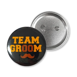 Detailed front and back view of Team Groom tinplate badges for wedding party decoration