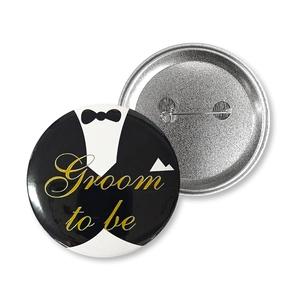 Front and back detail of 58mm Groom to be tinplate badge with safety pin fastener